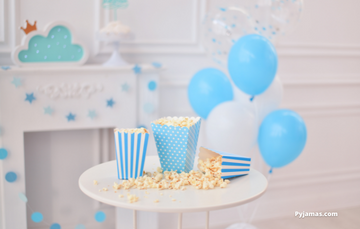 Blue and white themed birthday balloons and popcorn