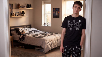 Boy in Star Wars Pyjamas in his Star Wars Bedroom