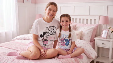 Mum and daughter wearing disney pyjamas