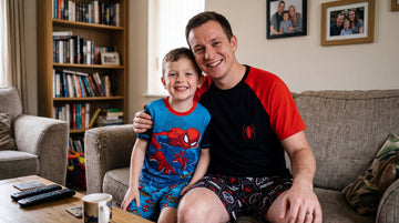Man and boy in marvel pyjamas
